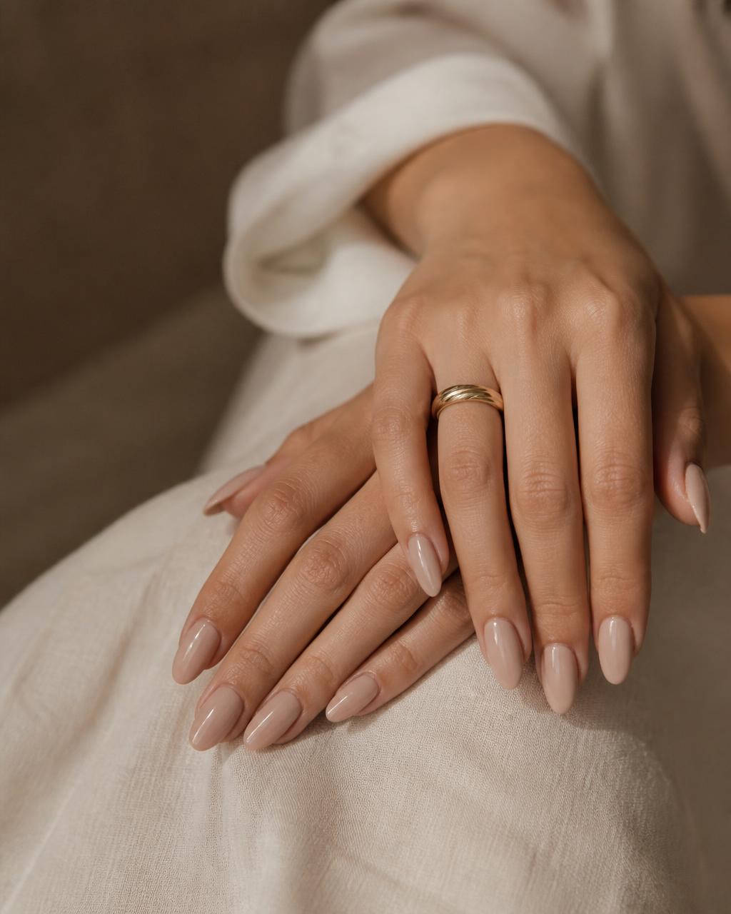 Elegant nude almond gel nails by Nails by Shey in Stoughton, MA